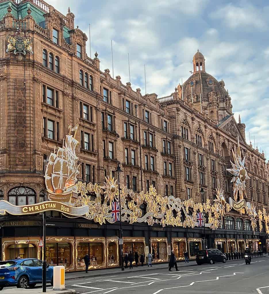 Image of the exterior of Harrods at Christmas. Harrods is a posh London department store, and anything in their iconic green bag will be a perfect gift from London. 