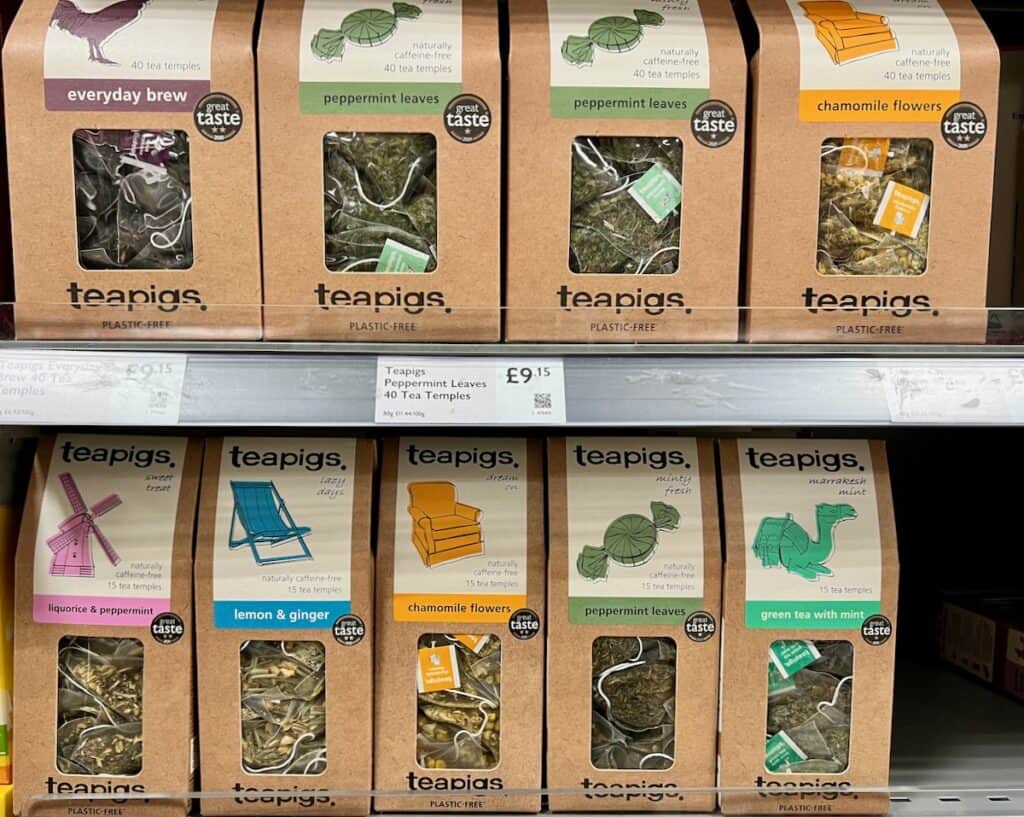 Tea is a great souvenir from London. Pictured: Teapigs, a British brand known for their quality, stacked on grocery shelves. 