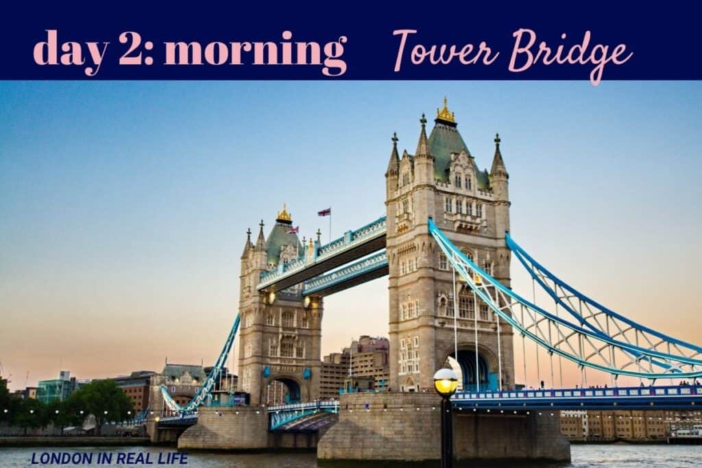 Day 2 morning visit in a 5-day London itinerary features the iconic Tower Bridge, with its distinctive blue and white suspension cables and Victorian Gothic towers against a clear dawn sky.